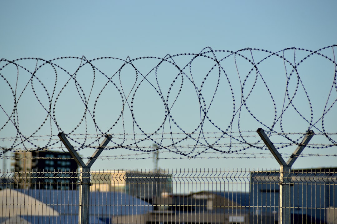 5. Perimeter Fencing With Clear Sightlines (Image Credits: Unsplash)